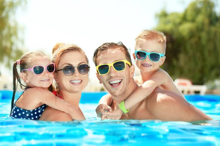 Family in resort swimming pool
