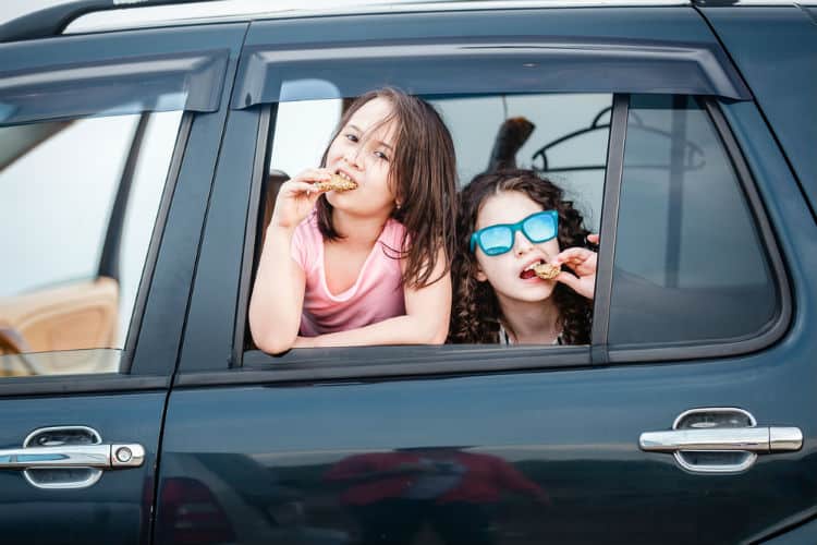 Kids eating in a car