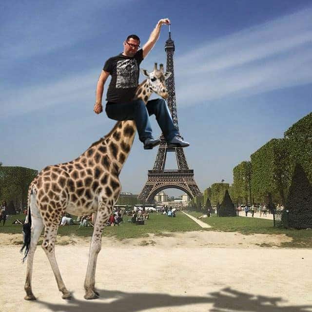 Eiffel Tower finger guy takes the help of a Giraffe