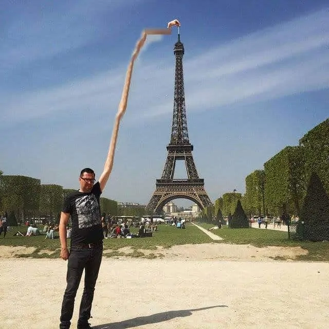 Sid Frisjes stretches himself to become the Eiffel Tower finger guy