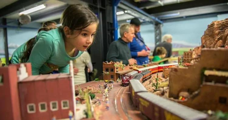 Girl watches a train in Miniature Wonderland, Hamburg