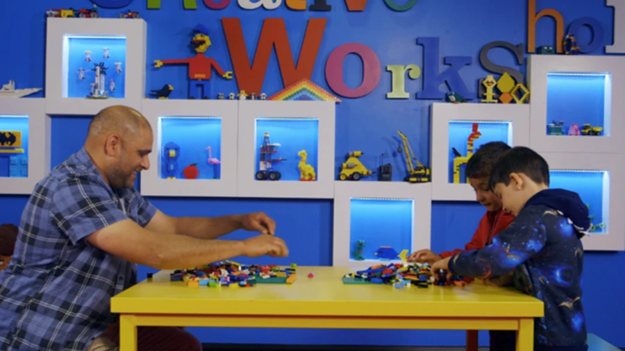 Father and sons enjoy Legoland Boston