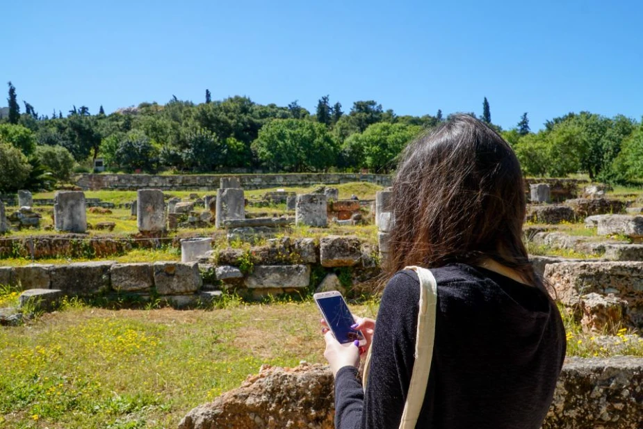 Tourist with Audio Tour in Ancient Agora Athens