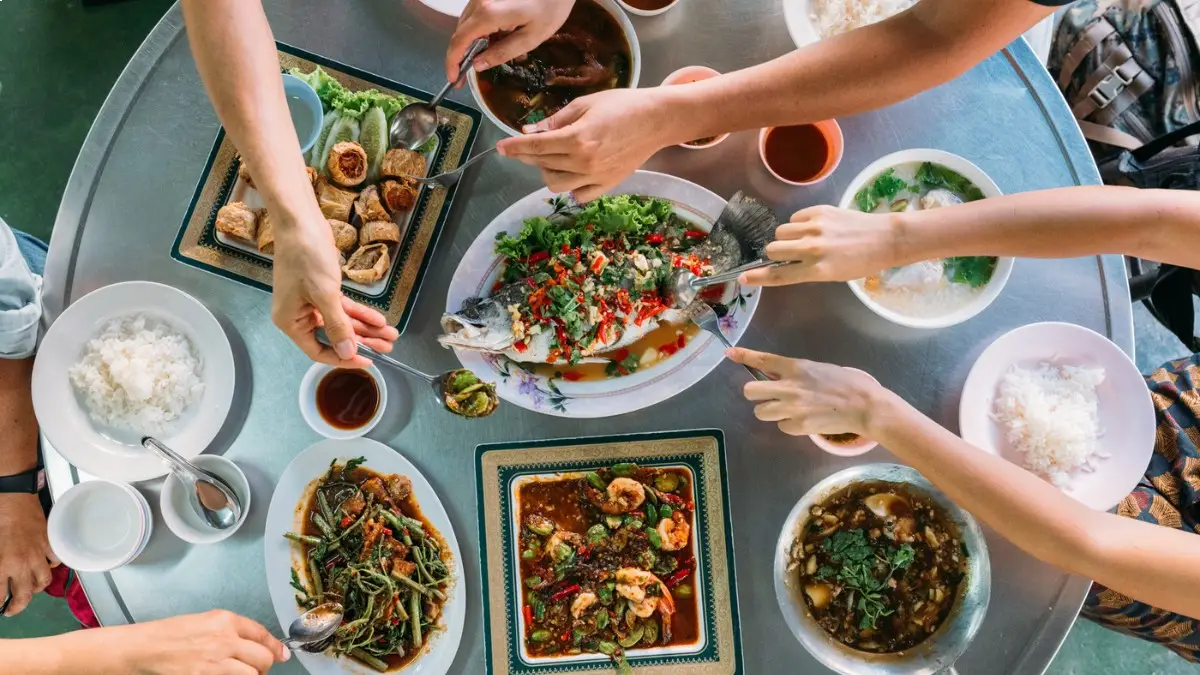 Authentic Thai cuisine served on a table, enjoyed by tourists in Bangkok