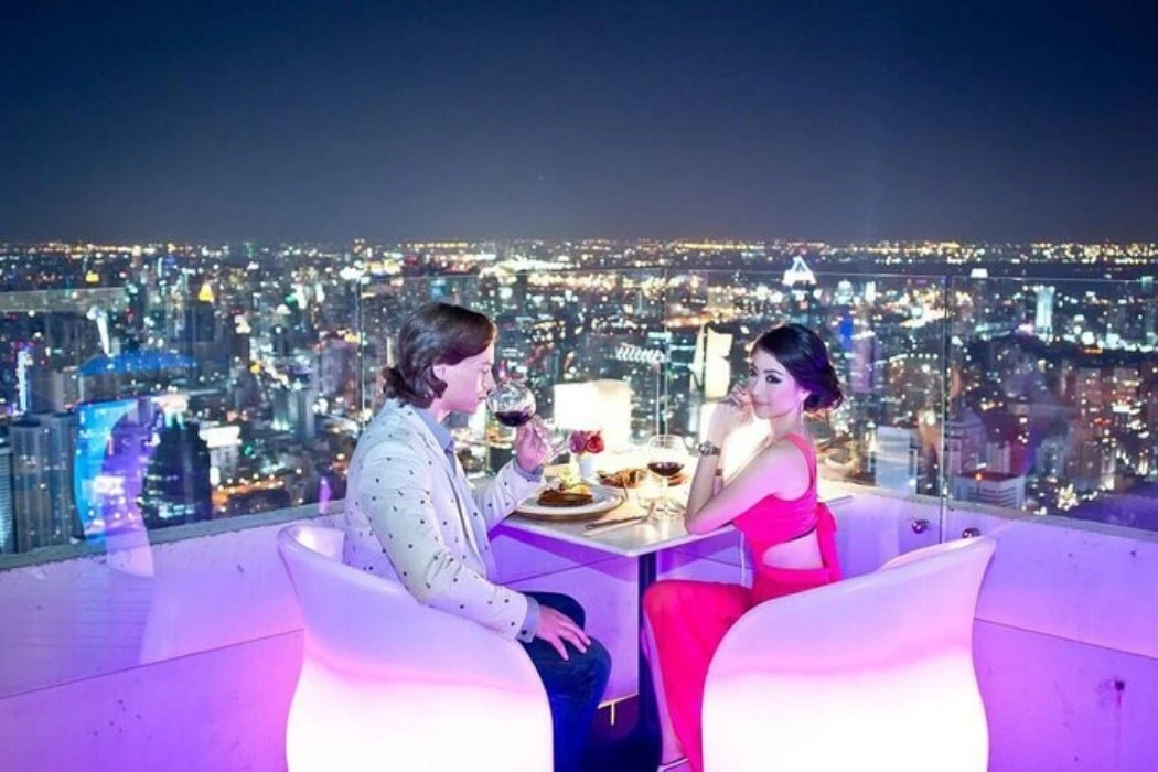 A couple having dinner at the Baiyoke Observation Deck.