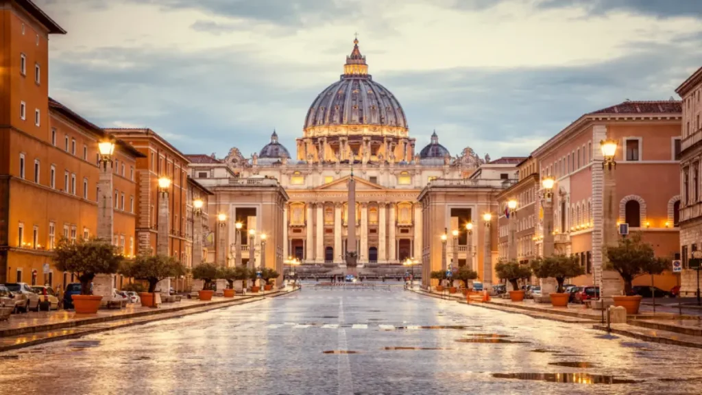 The Vatican Museums glow with shining lights in the evening.