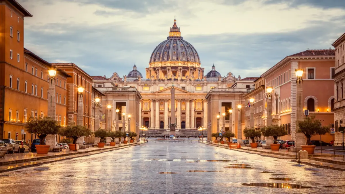 The Vatican Museums glow with shining lights in the evening.