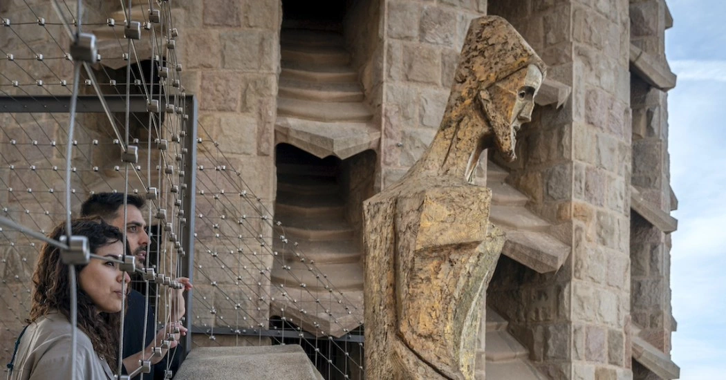 Visitors looking at the ‘Resurrection’ depicted in Passion facade