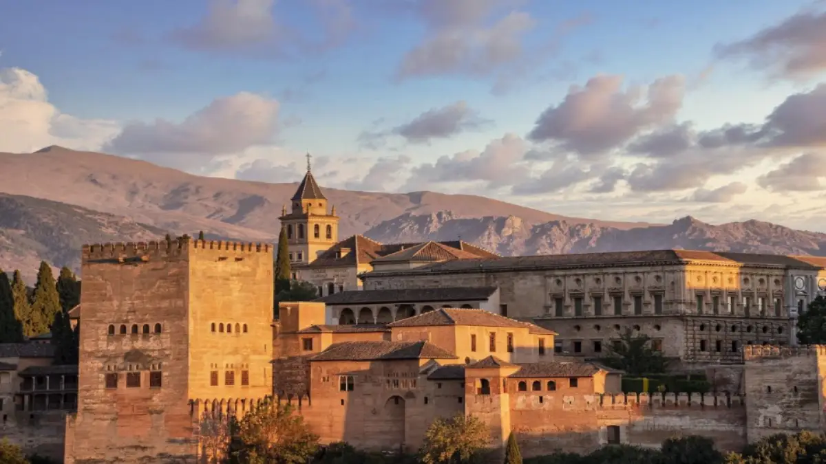 Beautiful Alhambra Palace during sunrise with the backdrop of the Sierra Nevada Mountains