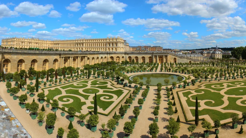 The Palace of Versailles with its beautiful gardens and clear blue sky. The Palace of Versailles with its beautiful gardens and clear blue sky.