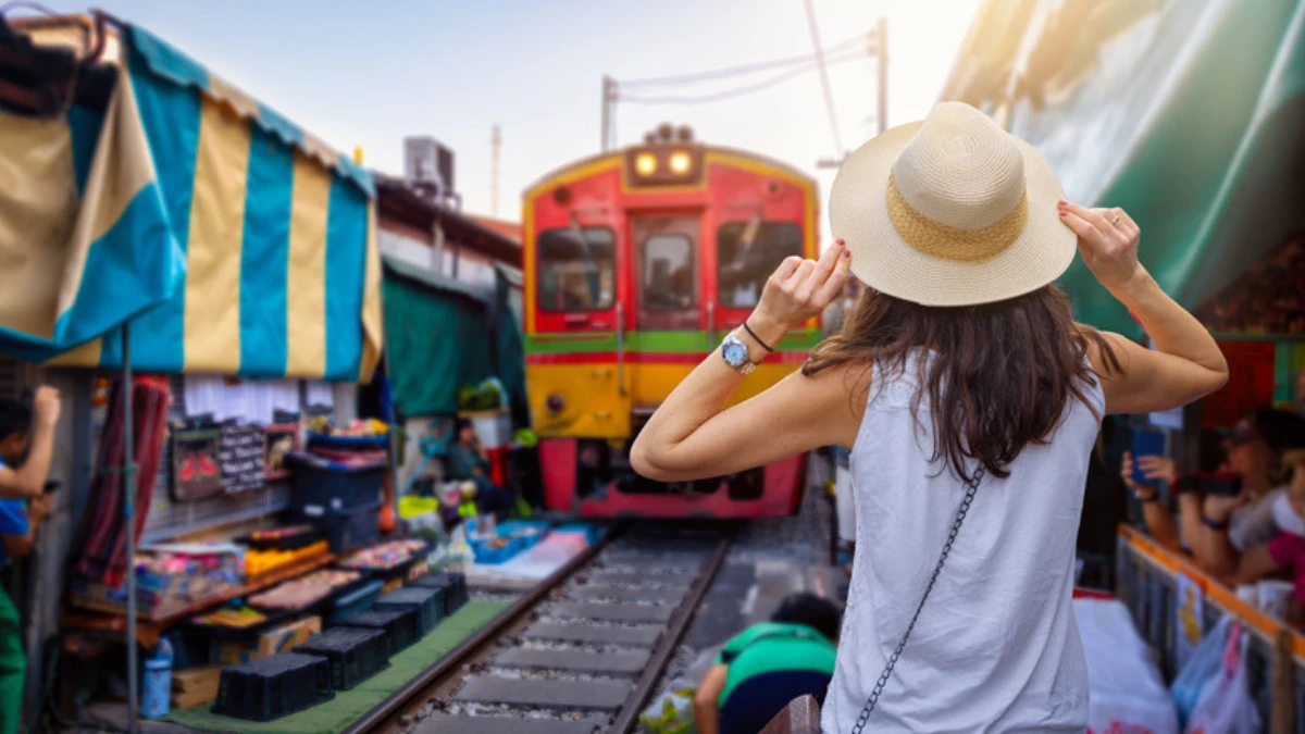 a woman standing on a train track